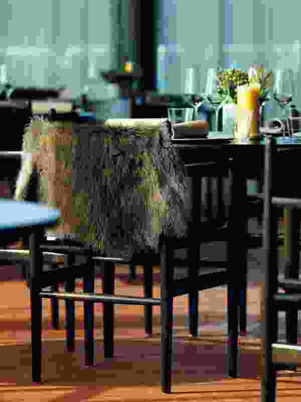 The dining room features Danish chairs with wallaby fur throws.