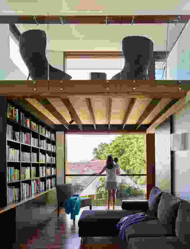 The study/library benefits from a full-height window, while the reading nook above offers a second place for quiet contemplation.