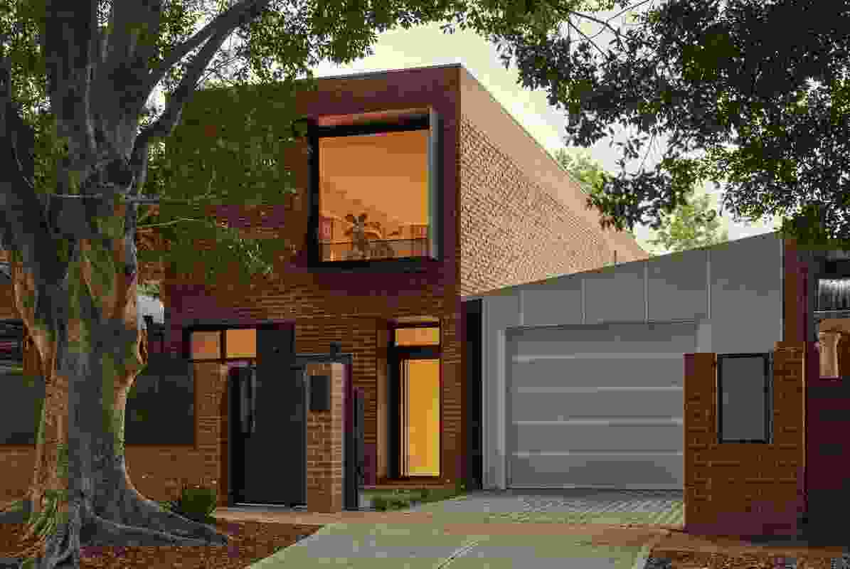 The site is provisionally split in two: the garage and side garden can be removed to make way for a mirror-image companion house.