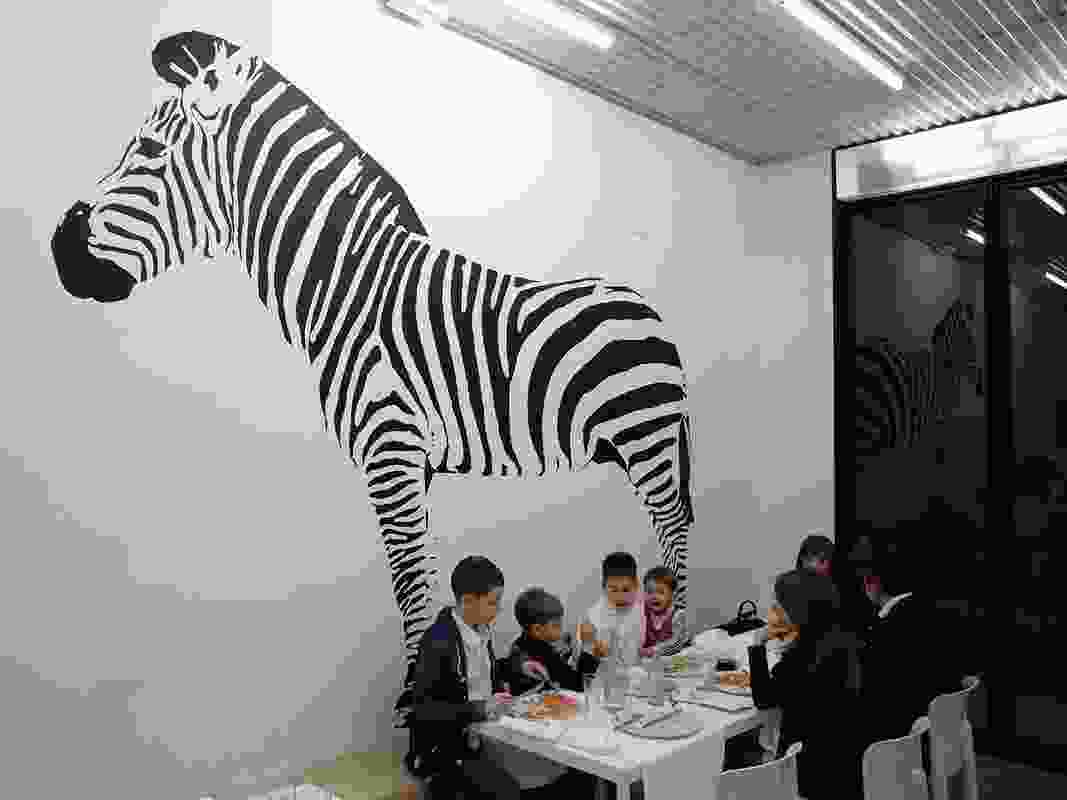 The opposite wall of Pizza Perez shows a 
large zebra, popular with children.