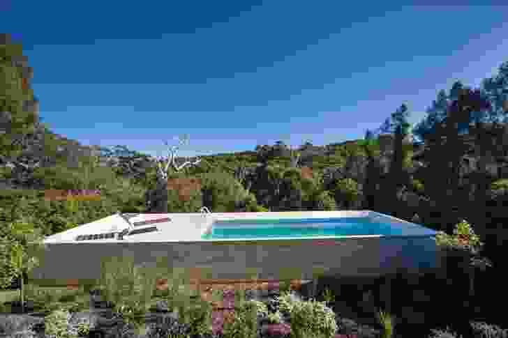 The raised pool in a bush garden evokes a Palm Springs setting. 