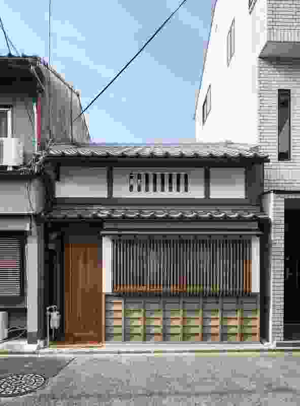 The front facade of the Kyoto Terrace House has been restored and includes traditional elements.