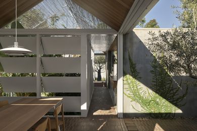 Sliding, stacking doors and casement panels allow the house to be open to light and breezes.