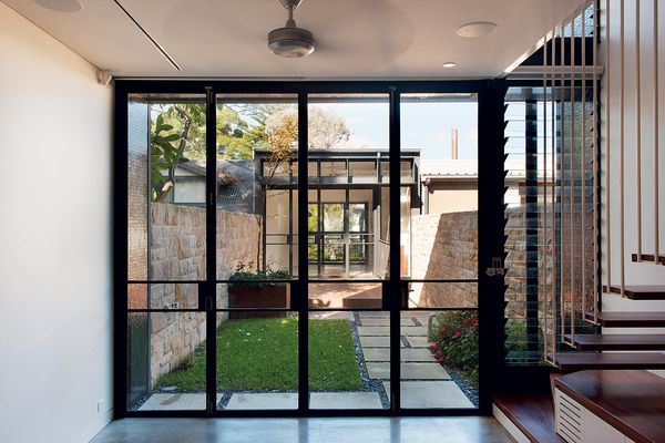 An enclosed courtyard separates the old and new sections of the house.