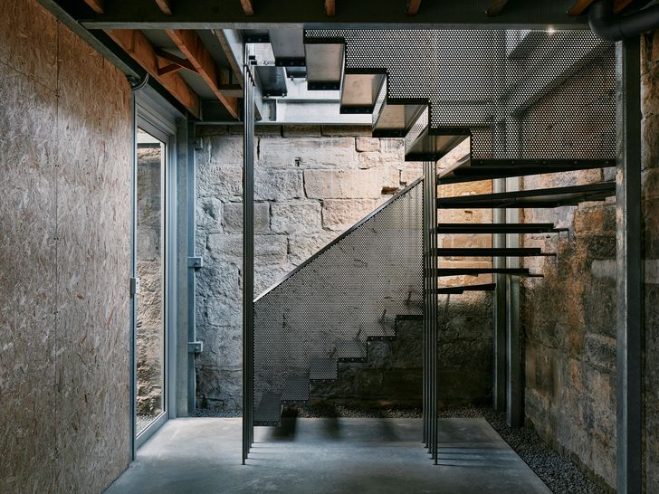 Like all of the spaces in the building, the stairs make use of the soft light from the rear courtyards.