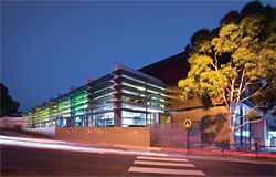 The Life Centre at Syndal Baptist Church, on the site of a former petrol station in suburban Melbourne, is designed to create a strong visual presence for the church and its outreach programs, without overtly reading as “church”. At night, coloured lighting aims to give the building a distinctive identity in the community.