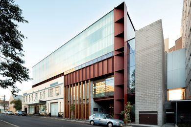 The view south along the institute’s Church Street frontage. The steel box beam at the right houses the entry and “vertical street.”