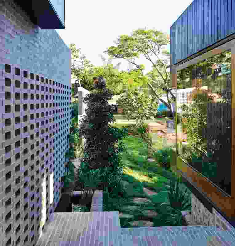 Bond brickwork frames and forms the house’s surprisingly park-like rear garden.