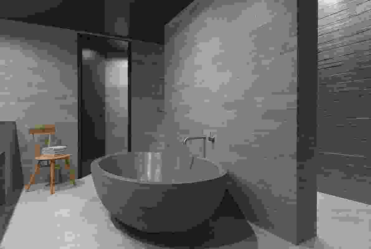 Some of the rooms’ bathrooms feature a custom-made concrete bathtub.