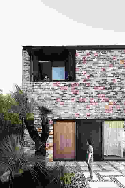 At Courtyard House, recycled brick extends and expands an existing cottage.