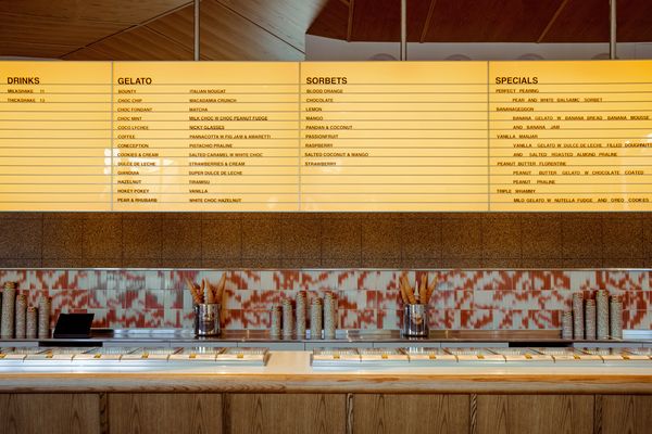 A suspended golden lightbox displays the changing flavour menu.