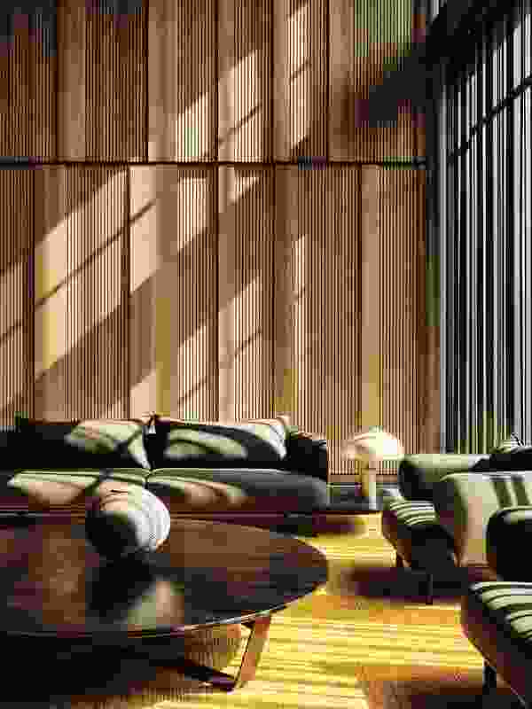 Sunlight drapes across walls lined with Australian blackbutt timber.