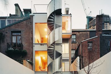 The striking aluminium-clad stair allows access to the garden and garage from the roof terrace without disturbing the occupants of the apartment below.