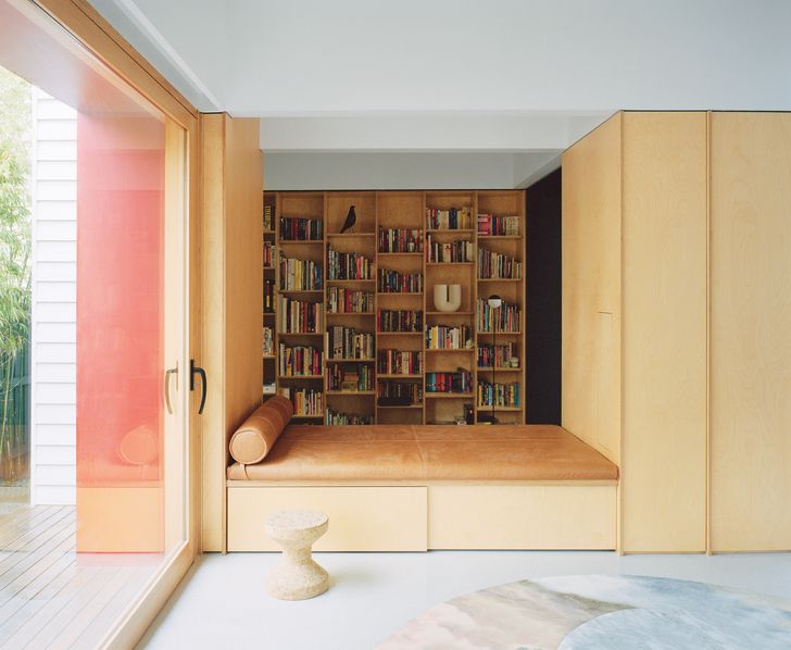 The study and living zones are linked by a plywood storage volume and daybed.