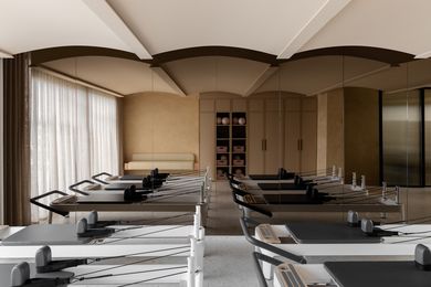 Softer tones of pale shell paired with Palladian terrazzo mosaic floor generate softness and calm in the reformer pilates studio.