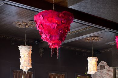 Large chandeliers add colour to a banqueting room.