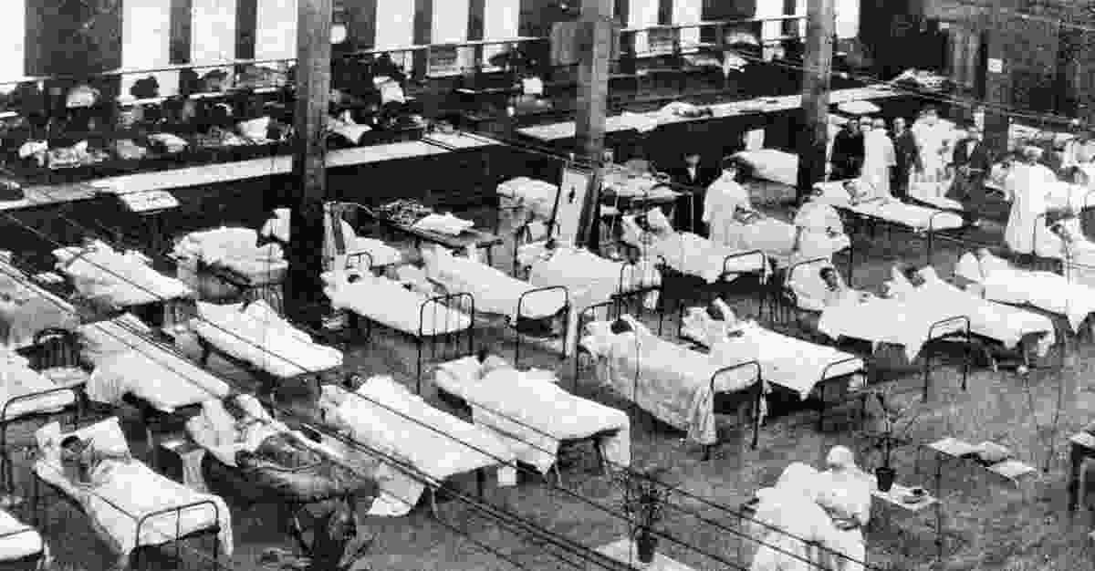 Hospital beds in Melbourne Exhibition Centre’s Great Hall during the Spanish influenza pandemic, c. 1919.