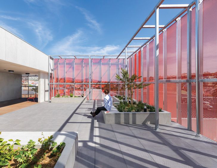 Shared social spaces occupy the upper levels, with expansive views across Hobart and out to Kunanyi/Mount Wellington.