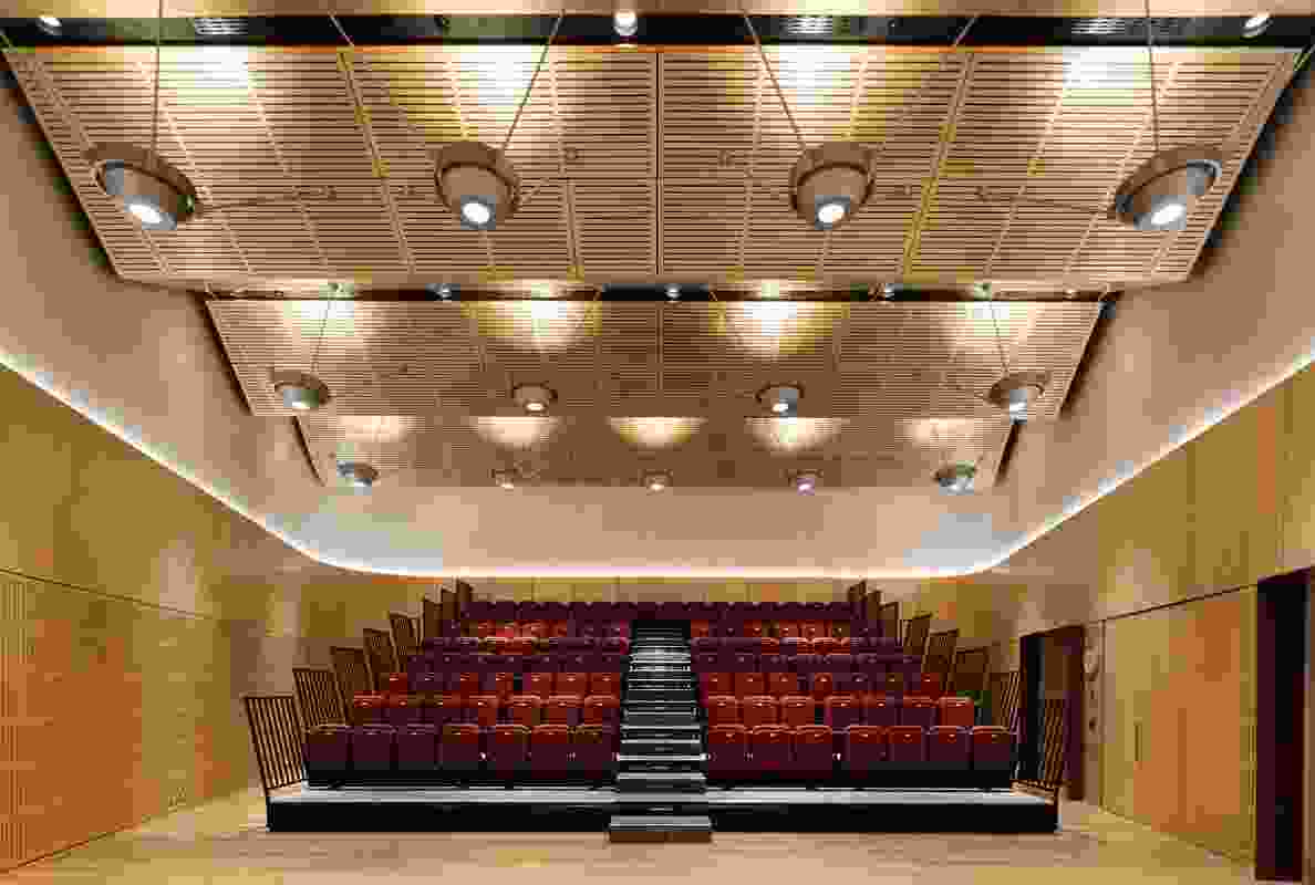 The chancery’s multipurpose room in auditorium mode: imported Australian blackbutt covers the walls, floor and ceiling.