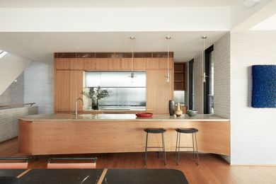 Timber joinery and reeded glass make the kitchen a worthy destination. Artwork: Zhuang Hong Yi.