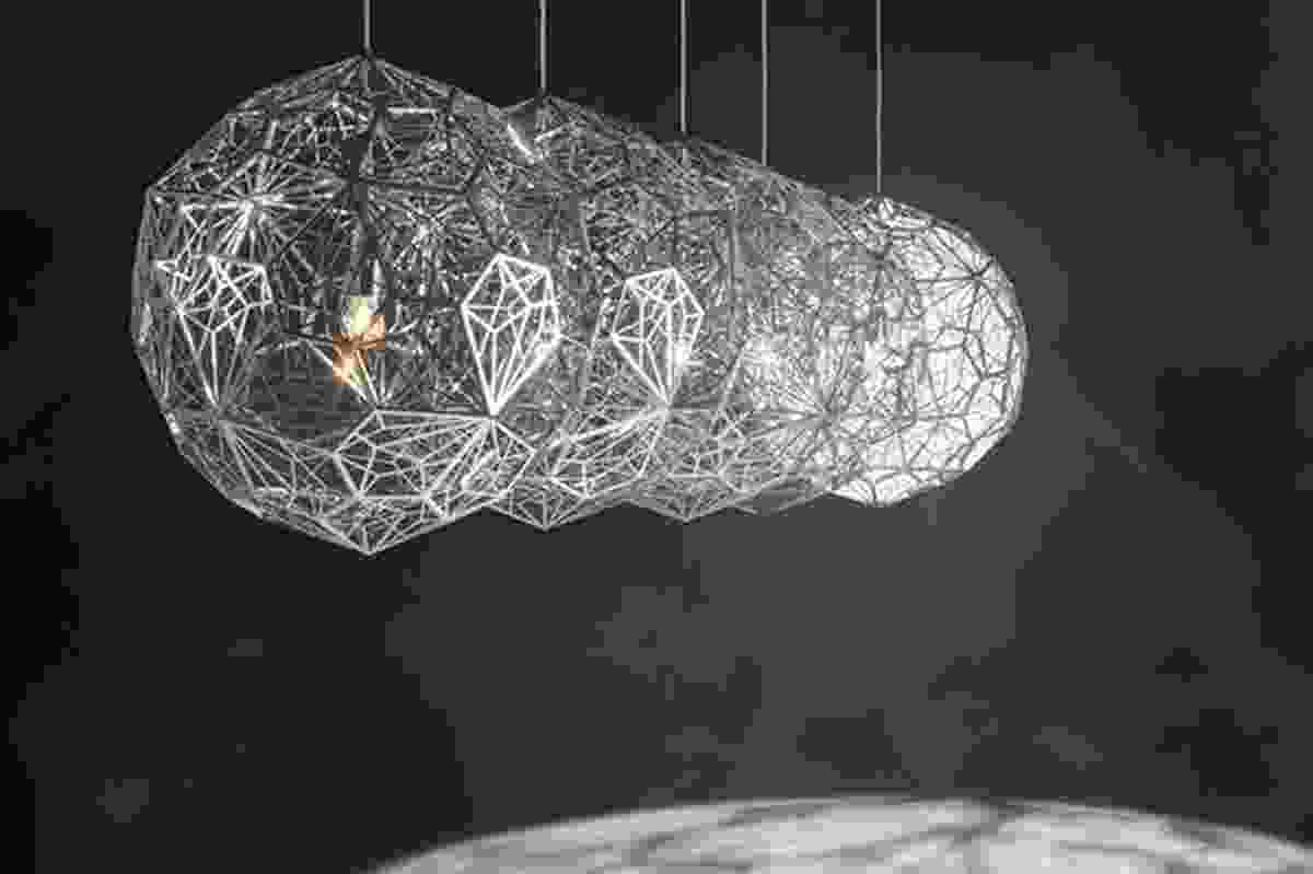 Etch Web light, a digital fabrication whose size, shape and material can be adapted.