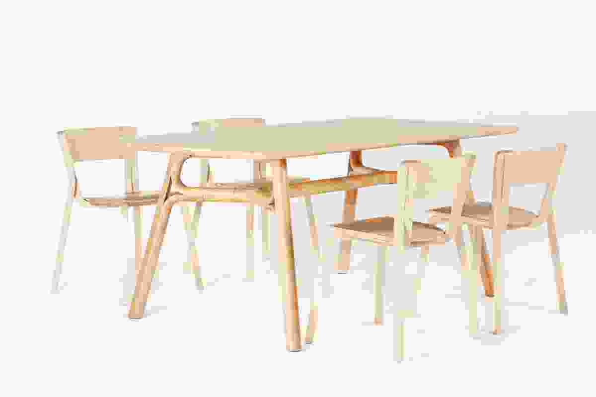 Justin Hutchinson Flow Dining Table and Adam Goodrum Para Dining Chairs in natural rubberwood.