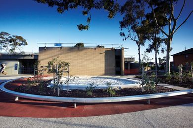 Young gum trees surround a circular sandpit in Preston Library’s forecourt.