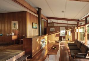 Enveloped by a broad gable roof, Porter House is designed across a split-level plan that works with the fall of the site.