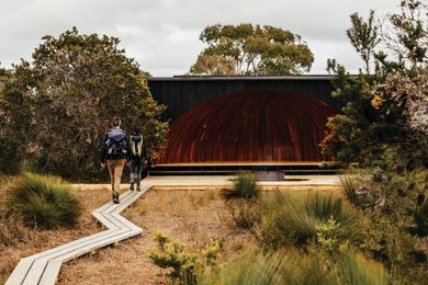 Nestled within an outpost of coastal banksia scrub, the timber boardwalk between camp site and beach zigs and zags to minimize disturbance to the local flora.