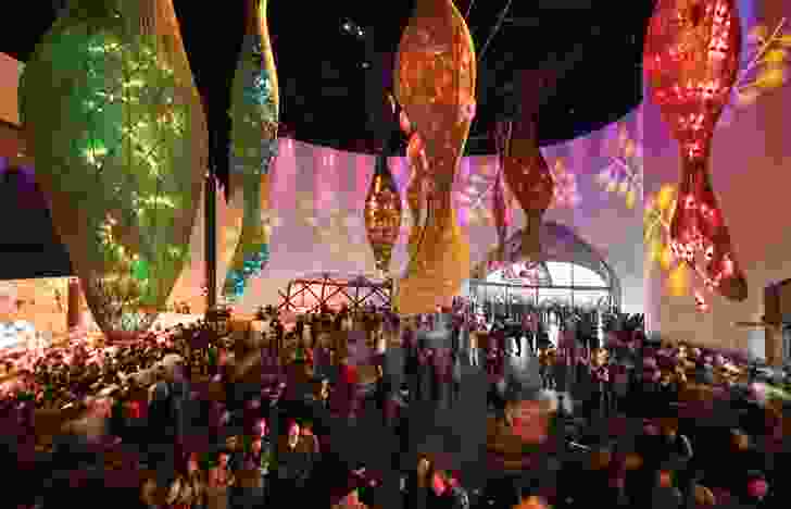 Act three, Enjoy, features large illuminated seed pods that hang from the ceiling.