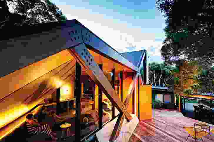 The slope of the roof plane reflects a contour line from the dune system the house sits upon.