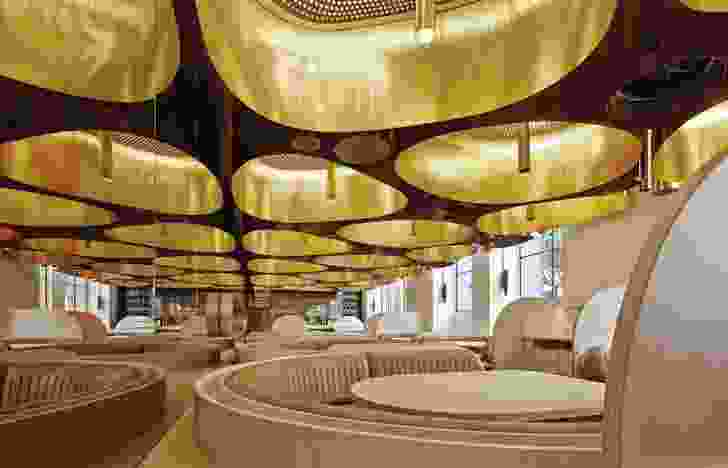 The custom-designed brass light fittings also work as acoustic baffles.