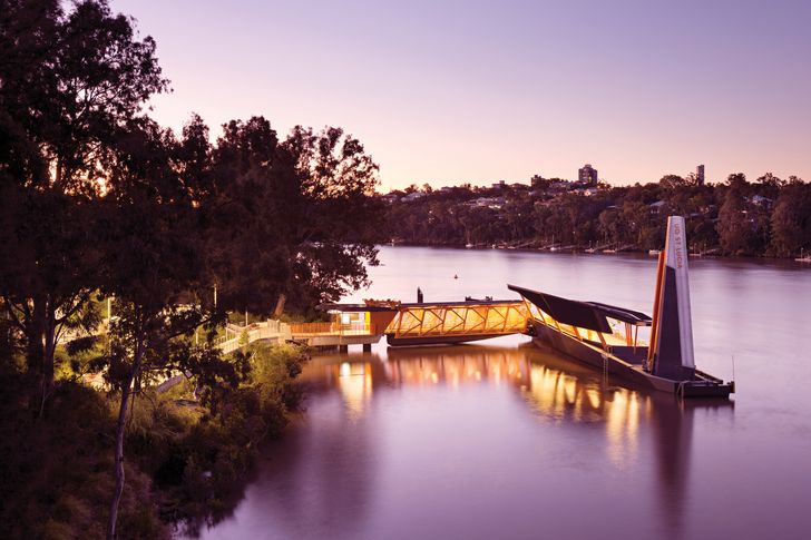 At the University of Queensland ferry wharf, the access path is aligned with tree and river views and integrates pause points to overcome monotony on the lengthy ramp journey.