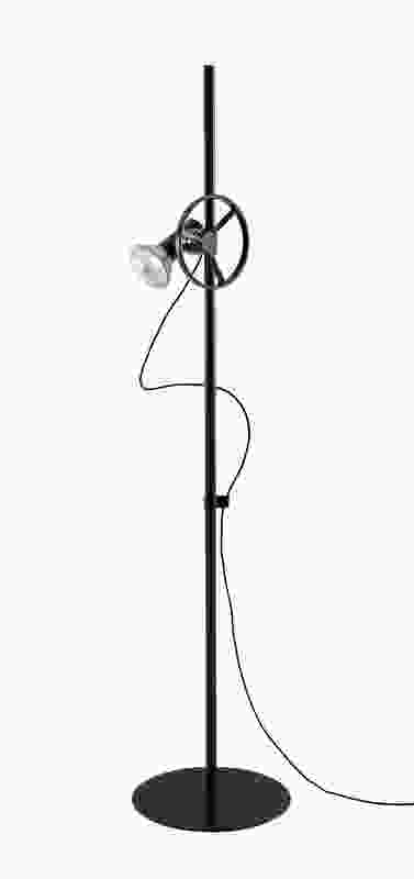 The Atelier floor lamp for Ligne Roset features a system for raising and lowering the bulb, which can be locked in place or unlocked by turning a cast aluminium wheel.